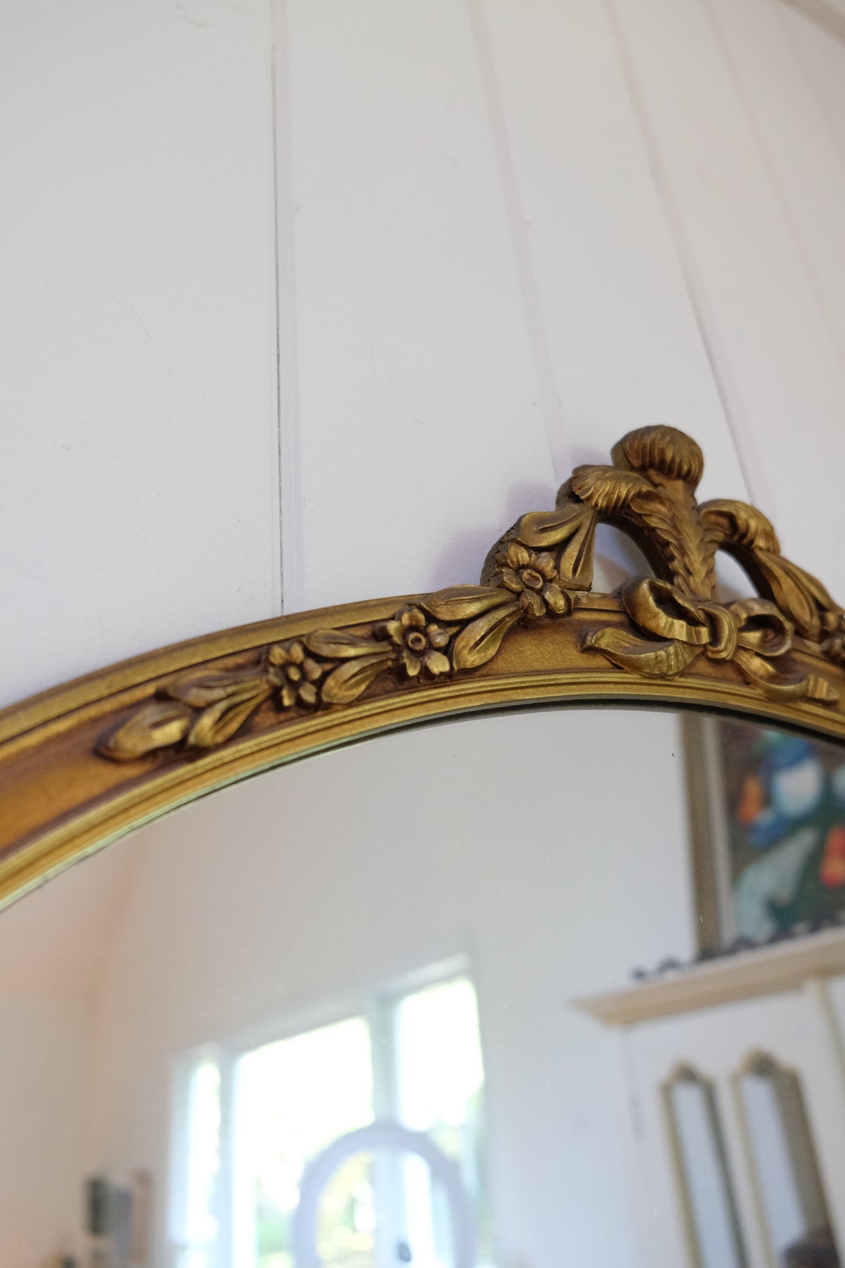 Vintage Carved Wood Gilt Oval Mirror with Floral & Bow Details