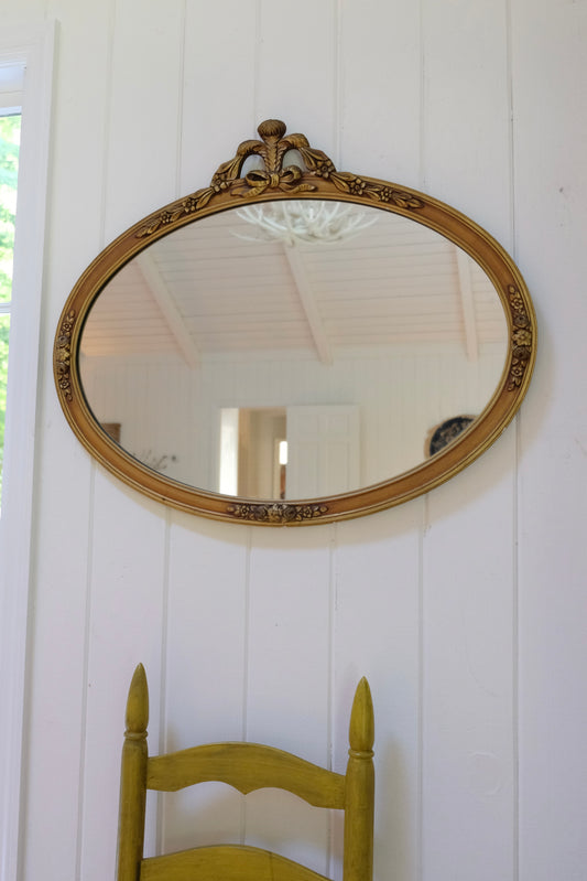 Vintage Carved Wood Gilt Oval Mirror with Floral & Bow Details